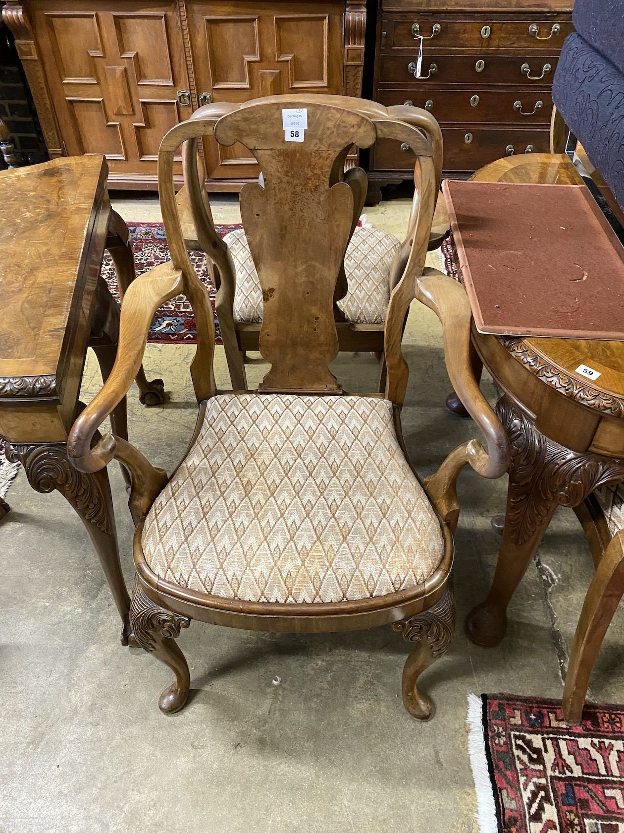 A set of eight Queen Anne revival walnut dining chairs, (two with arms, six single)